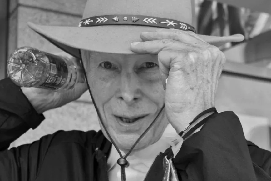 Leonard Pickard putting on his typical hat